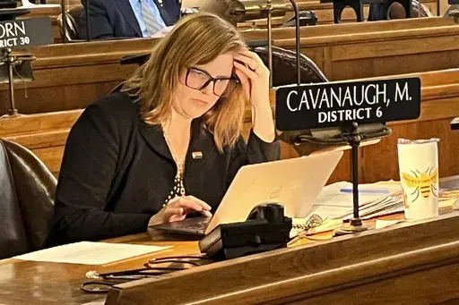 State Sen. Machaela Cavanaugh prepares to speak before the Nebraska Legislature Monday, March 13, 2023, at the Nebraska State Capital in Lincoln, Neb. Cavanaugh is in her third week of an effort to filibuster every bill that comes before the Legislature this session — even the ones she supports. The effort is a protest against conservatives' advancement of a bill that would outlaw gender-affirming therapies for those 18 and younger. Cavanaugh has declared she will "burn the session to the grou