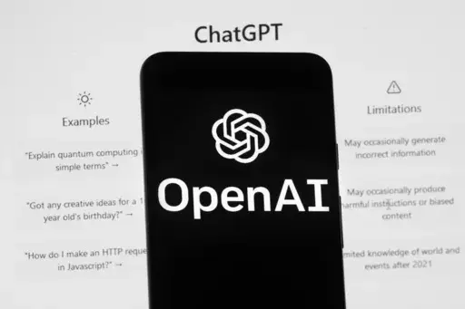 The OpenAI logo is seen on a mobile phone in front of a computer screen which displays the ChatGPT home Screen, on March 17, 2023, in Boston. ChatGPT's maker said Friday April 28, 2023 that the artificial intelligence chatbot is available again in Italy after the company met the demands of regulators who temporarily blocked it over privacy concerns. (AP Photo/Michael Dwyer, File)