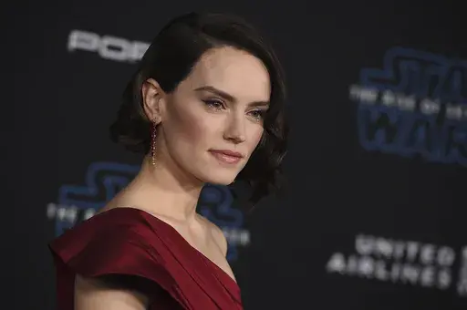 Daisy Ridley arrives at the world premiere of "Star Wars: The Rise of Skywalker" on Dec. 16, 2019, in Los Angeles. Lucasfilm announced three new live-action films in the "Star Wars" franchise which includes the return of Ridley as Rey. (Jordan Strauss/Invision/AP, File)