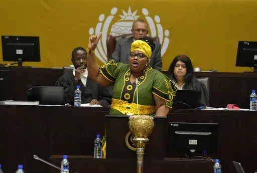 Pemmy Majodina, chief whip of the ruling African National Congress, addresses members of parliament in Cape Town, South Africa, Tuesday, Nov. 21, 2023. The majority of MP's voted to close the Israeli embassy in South Africa over the war in Gaza. (AP Photo/Nardus Engelbrecht)