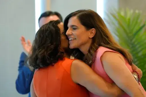 Former state Rep. Katie Arrington, left, hugs U.S. Rep. Nancy Mace, right, after giving her public support for her campaign on Thursday, June 16, 2022, in Charleston, S.C. Mace defeated the Trump-backed Arrington in South Carolina's 1st District Republican primary on Tuesday. (AP Photo/Meg Kinnard)