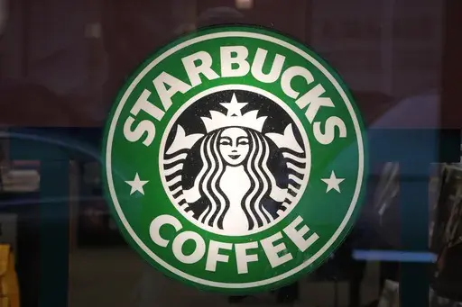The Starbucks sign is displayed in the window of a Pittsburgh Starbucks, Jan. 30, 2023. On Monday, June 12, jurors in a federal court in New Jersey awarded $25.6 million to a former regional Starbucks manager who alleged that she and other white employees were unfairly punished by the coffee chain after the high-profile 2018 arrests of two Black men at one of the chain's Philadelphia locations. (AP Photo/Gene J. Puskar, File)