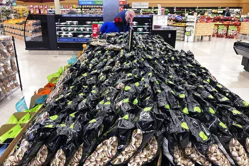 Bags of Pistachios are displayed at a grocery store in Mount Prospect, Ill., on, April 1, 2022. Consumer prices surged 8.6% last month from 12 months earlier, faster than April’s year-over-year surge of 8.3%, the Labor Department said Friday, June 10, 2022. (AP Photo/Nam Y. Huh)