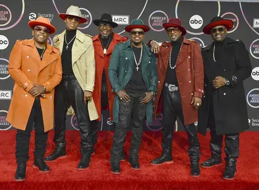 Michael Bivins, from left, Ronnie Devoe, Bobby Brown, Ricky Bell, Ralph Tresvant and Johnny Gill of New Edition appear in the press room at the American Music Awards in Los Angeles on Nov. 21, 2021. The group will perform on ABC's “New Year’s Rockin’ Eve.” (Photo by Jordan Strauss/Invision/AP, File)
