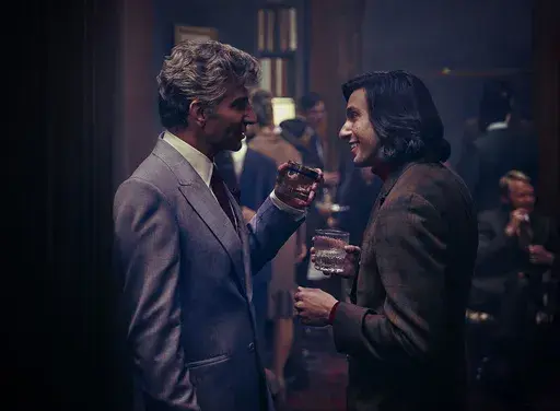 This image released by Netflix shows Bradley Cooper as Leonard Bernstein, left, and Gideon Glick as Tommy Cothran in a scene from "Maestro." (Jason McDonald/Netflix via AP)