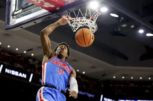 Mississippi guard Matthew Murrell dunks during the first half of an NCAA college basketball game against Auburn, Feb. 23, 2022, in Auburn, Ala. Led by guards Daeshon Ruffin and Murrell, Mississippi is trying to improve on a 13-19 record that included only four Southeastern Conference wins. (AP Photo/Butch Dill, File)