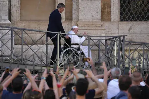 FILE-- Pope Francis greets the faithful as he leaves St. Mary Major Basilica after participating in a rosary prayer for peace, in Rome, Tuesday, May 31, 2022. Pope Francis canceled a planned July trip to Africa on doctors' orders because of ongoing knee problems, the Vatican said Friday, June 10, 2022, raising further questions about the health and mobility problems of the 85-year-old pontiff.  (AP Photo/Gregorio Borgia)