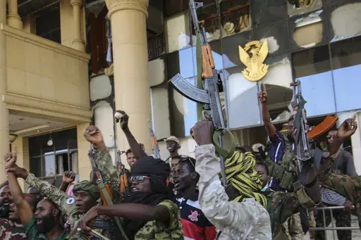 Sudan army soldiers celebrate after they took over the Republican Palace in Khartoum, Sudan, Friday, March 21, 2025. (AP Photo)