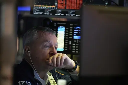 James Lamb works on the floor at the New York Stock Exchange in New York, Monday, April 7, 2025. (AP Photo/Seth Wenig)