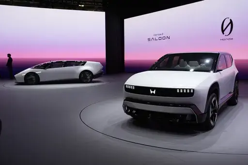The Honda 0 SUV, right, and Honda 0 Saloon EV prototypes are on display at the Honda booth during the CES tech show Tuesday, Jan. 7, 2025, in Las Vegas. (AP Photo/John Locher)