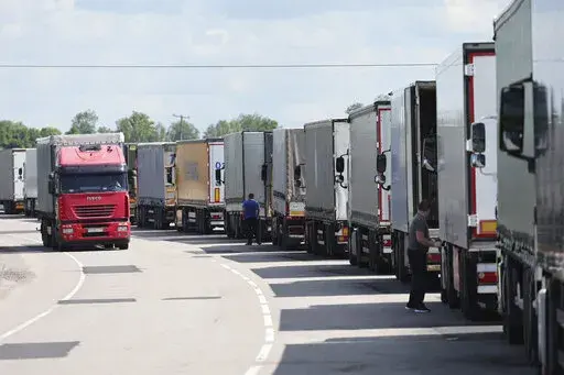 Trucks stands at the post-customs international checkpoint Chernyshevskoye at the Russian-Lithuanian border in Kaliningrad region, Russia, Wednesday, June 22, 2022. Russia’s security chief on Tuesday said Moscow will respond to Lithuania’s decision to bar rail transit of goods subject to European Union sanctions from Russia to Russia's Baltic exclave of Kaliningrad. (AP Photo)
