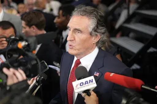 North Dakota Gov. Doug Burgum speaks to reporters in the spin room after a presidential debate between President Joe Biden and Republican presidential candidate former President Donald Trump in Atlanta, June 27, 2024. (AP Photo/Pablo Martinez Monsivais, File)