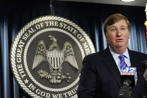 Republican Gov. Tate Reeves responds to a reporter's question during a news conference Tuesday, Nov. 1, 2022, in Jackson, Miss., regarding his calling lawmakers into special session Wednesday to consider incentives for an economic development project. (AP Photo/Rogelio V. Solis)