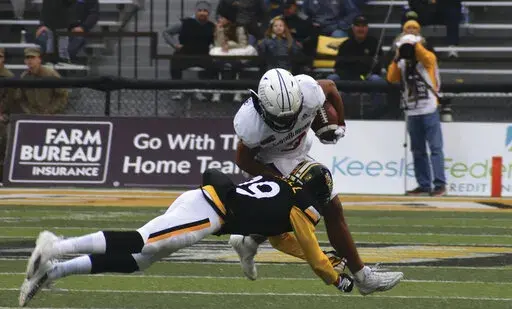 South Alabama Receiver Devin Voisin tries to break the tackle from Southern Miss Safety Camron Harrell in the first half of an NCAA college football game on Saturday, Nov. 19, 2022, in Hattiesburg, Miss. (Aimee Cronan/The Gazebo Gazette via AP)