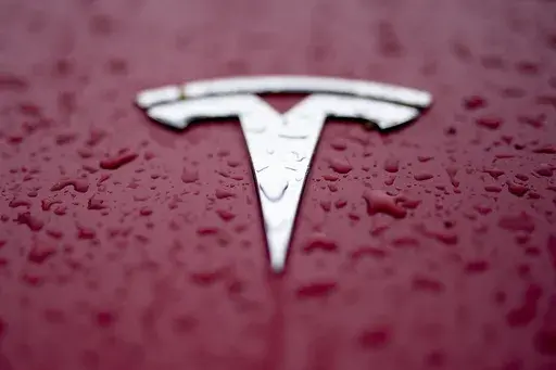 A Tesla logo is shown on Feb. 27, 2024, in Charlotte, N.C. Authorities in Washington announced Tuesday, July 30 that the Tesla that hit and killed a motorcyclist near Seattle in April was operating on the company’s “Full Self Driving” system. (AP Photo/Chris Carlson, File)