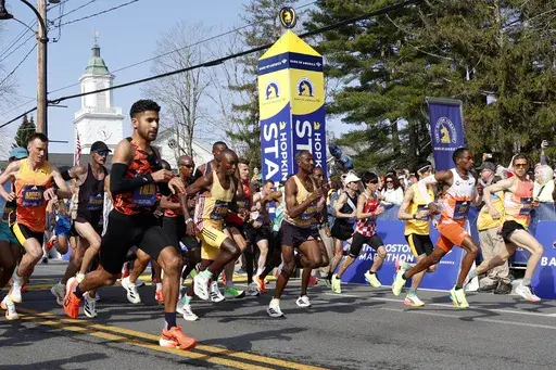 Elite male runners break from the start line of the Boston Marathon, Monday, April 15, 2024, in Hopkinton, Mass. (AP Photo/Mary Schwalm)