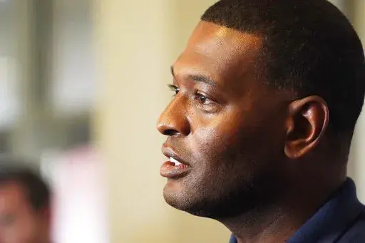 Environmental Protection Agency Administrator Michael Regan discusses elements of a coordinated response of federal, state and city agencies, that he hopes will help deal with the city's long-standing water problems, during a news briefing, Sept. 7, 2022, in Jackson, Miss. The Biden administration is proposing lower limits for a deadly air pollutant, saying tougher standards for soot from tailpipes, smokestacks and wildfires could prevent thousands of premature deaths a year. (AP Photo/Rogelio V
