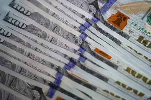 U.S. $100 bills are seen, Thursday, July 14, 2022, in Marple Township, Pa. If you earned a bank sign-up bonus or interest, you need to set aside some of it for taxes. Your tax bracket will determine how much you owe on your earnings, which will be between 10%-37% of the total. Avoid stress during tax season by setting aside earnings in advance. Also, don’t get a bank account simply for the bonus; you’ll want to make sure it has other good features. If you’re thinking about earning multiple