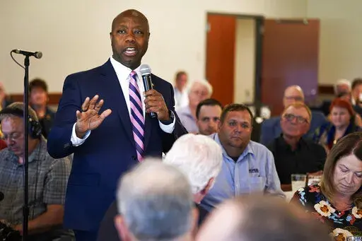 Sen. Tim Scott, R-S.C., speaks during an Iowa GOP reception, Thursday, June 9, 2022, in Cedar Rapids, Iowa. At least a half dozen GOP presidential prospects are planning Iowa visits this summer, forays that are advertised as promoting candidates and the state Republican organization ahead of the fall midterm elections. But in reality, the trips are about building relationships and learning the political geography in the state scheduled to launch the campaign for the party's 2024 nomination. (AP 