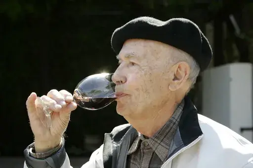 Winemaker Mike Grgich sips a glass of his Cabernet Sauvignon wine at the Grgich Hills Estate winery in Rutherford, Calif., on Sept. 15, 2008. Grgich, a celebrated winemaker who helped establish Napa Valley as one of the world’s premier wine-making regions, has died. He was 100. (AP Photo/Eric Risberg, File)