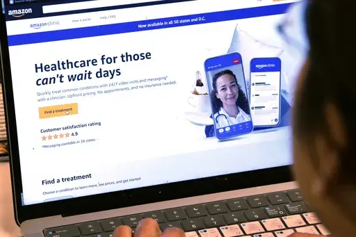 A page from Amazon's clinic site is shown on a laptop in New York on Tuesday, Aug. 1, 2023. Amazon is adding video telemedicine visits in all 50 states to the virtual clinic it launched last fall, as the e-commerce giant pushes deeper into care delivery. (AP Photo/Peter Morgan)