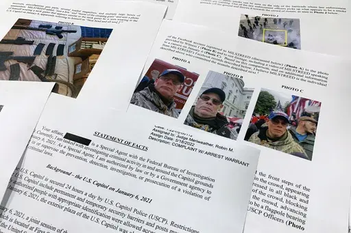 The statement of facts to support the arrest warrant for Rodney Milstreed of Finksburg, Md., is photographed Tuesday, May 24, 2022 in Washington. (AP Photo/Jon Elswick, File)