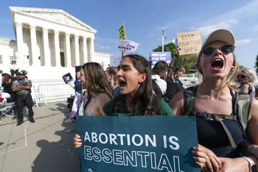 Demonstrators protest outside of the U.S. Supreme Court, Tuesday, May 3, 2022 in Washington. The traditionally insular Supreme Court is about to face the full force of public pressure and abortion politics. Justices are deciding whether to throw out the landmark Roe v. Wade ruling. A leaked draft opinion suggests the conservative justices are prepared to overturn the 1973 opinion that gives women legal access to the procedure. (AP Photo/Alex Brandon, File)