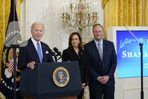 President Joe Biden speaks during a reception to celebrate the Jewish new year in the East Room of the White House in Washington, Friday, Sept. 30, 2022. Vice President Kamala Harris and her husband Doug Emhoff look on at right. Biden on Thursday, May 25, 2023, announced what he said is the most ambitious and comprehensive undertaking by the U.S. government to fight hate, bias and violence against Jews, outlining more than 100 steps the administration and its partners can take to combat an alarm