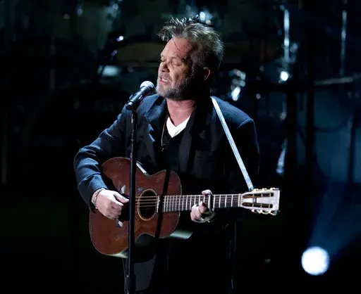 John Mellencamp performs during a tribute concert to Billy Joel, the recipient of the Library of Congress Gershwin Prize for Popular Song in Washington on Nov. 19, 2014. Mellencamp's 1985 album “Scarecrow” is being reissued this week. (AP Photo/Carolyn Kaster, File)