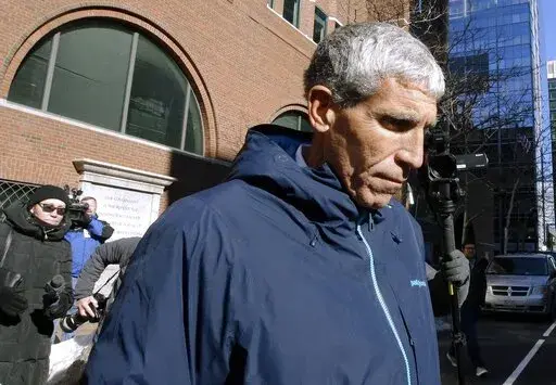 William "Rick" Singer founder of the Edge College & Career Network, departs federal court in Boston, on March 12, 2019. The mastermind of the nationwide college admissions bribery scandal is set to be sentenced on Wednesday, Jan. 4, 2023, after helping authorities secure the convictions of a slew of wealthy parents involved in his scheme to rig the selection process at top-tier schools. (AP Photo/Steven Senne, File)