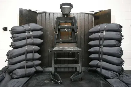 A chair sits in the execution chamber at the Utah State Prison on June 18, 2010, after Ronnie Lee Gardner was executed by firing squad in Draper, Utah. Idaho lawmakers passed a bill on March 20, 2023, that would authorize the use of firing squads if the state is unable to obtain drugs required for its lethal injection program. The bill will head to the desk of Idaho Gov. Brad Little next. (Trent Nelson/The Salt Lake Tribune via AP, Pool, File)