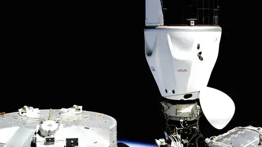 In this image provided by SpaceX, the Crew Dragon capsule is docked at the International Space Station, Wednesday, April 27, 2022. four astronauts arrived at the space station Wednesday night, just 16 hours after a predawn liftoff from Kennedy Space Center that thrilled spectators. (SpaceX via AP)