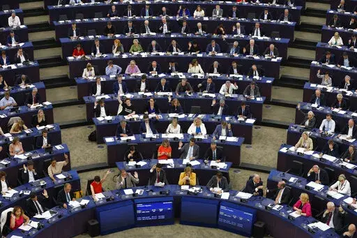 European lawmakers vote on climate change issues at the European Parliament in Strasbourg, eastern France, Tuesday, Sept. 13, 2022. European Union lawmakers have backed a proposal for a law that would ban the sale in the 27-nation bloc of agriculture products linked to the destruction of forests. (AP Photo/Jean-Francois Badias)