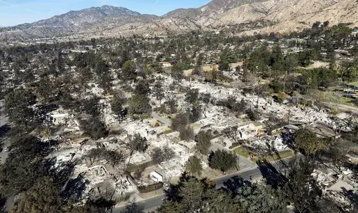 Residences destroyed by the Eaton Fire line a neighborhood in Altadena, Calif., on Tuesday, Jan. 21, 2025. (AP Photo/Noah Berger, File)