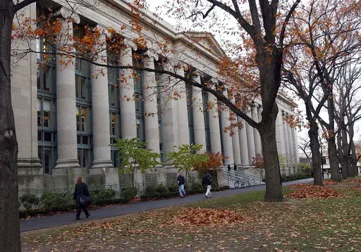 Students walk through the Harvard Law School area on the campus of Harvard University in Cambridge, Mass., on Nov. 19, 2002. The University of California, Berkeley's law school on Thursday, Nov. 17, 2022, joined the law programs at Harvard and Yale in pulling out of U.S. News & World Report rankings over concerns that the rating system punishes efforts to attract students from a broad range of backgrounds. (AP Photo/Chitose Suzuki, File)