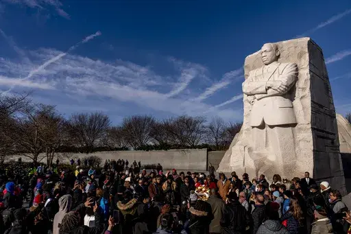 People attend a wreath-laying ceremony at the Martin Luther King Jr. Memorial marking MLK Day in Washington, Jan. 16, 2023. (AP Photo/Andrew Harnik, File)