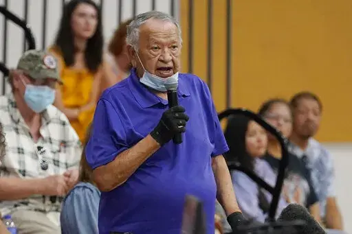 Donald Neconie, 84, a former U.S. Marine and member of the Kiowa Tribe, recounts his experiences as a child at an Indian boarding school Saturday, July 9, 2022, in Anadarko, Okla., during a meeting to hear about the painful experiences of Native Americans who were sent to government-backed boarding schools designed to strip them of their cultural identities. One by one, Native American tribal elders who were once students at government-backed Indian boarding schools testified about the hardships