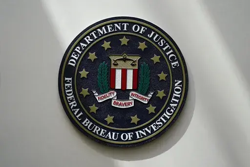 The FBI seal is pictured in Omaha, Neb., Aug. 10, 2022. A sharply divided privacy oversight board is recommending that the FBI and other agencies be required to get court approval before reviewing the communications of U.S. citizens collected through a secretive foreign surveillance program. (AP Photo/Charlie Neibergall, File)