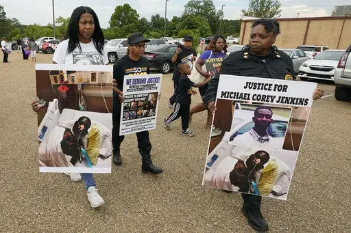 Activists march towards the Rankin County Sheriff's Office in Brandon, Miss., Wednesday, July 5, 2023, calling for the termination and prosecution of Rankin County Sheriff Bryan Bailey for running a law enforcement department that allegedly terrorizes and brutalizes minorities. Six white former law enforcement officers in Mississippi have pleaded guilty to a racist assault on Michael Corey Jenkins and his friend Eddie Terrell Parker, who are Black. (AP Photo/Rogelio V. Solis, File)