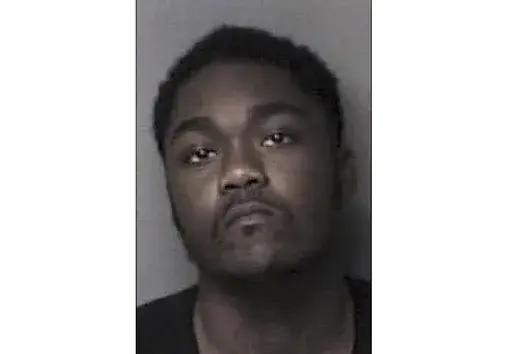 This Dec. 2022 image provided by the City of Gastonia Police Department shows Robert Louis Singletary. Authorities are searching for the man accused of shooting and wounding a 6-year-old North Carolina girl and her parents. A neighbor says the Tuesday night shooting near Gastonia happened after children tried to retrieve a basketball that rolled into Singletary's yard. (City of Gastonia Police Department via AP)