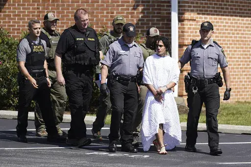 CORRECTS SPELLING OF FIRST NAME TO DANILO INSTEAD OF DANELO - Law enforcement officers escort Danilo Cavalcante from a Pennsylvania State Police barracks in Avondale Pa., Wednesday, Sept. 13, 2023. Cavalcante was captured Wednesday after eluding hundreds of searchers for two weeks. (AP Photo/Matt Rourke)