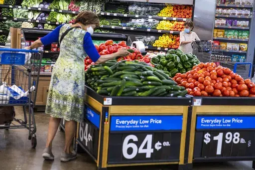 People buy groceries at a Walmart Superstore in Secaucus, New Jersey, July 11, 2024. (AP Photo/Eduardo Munoz Alvarez, File)