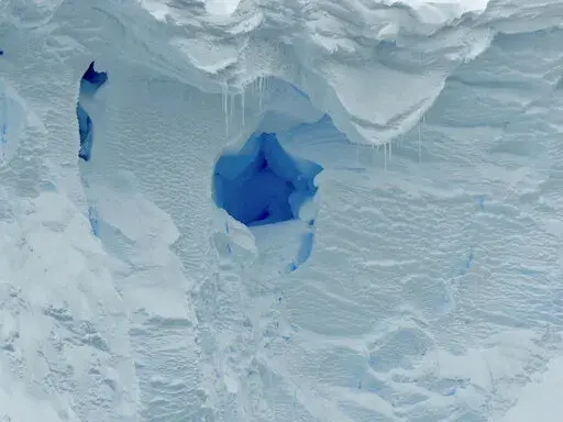 This 2019 photo provided by the British Antarctic Survey shows a hole in the Thwaites glacier in Antarctica. Starting Thursday, Jan. 6, 2021, a team of scientists are sailing to the massive but melting Thwaites glacier, “the place in the world that’s the hardest to get to,” so they can better figure out how much and how fast seas will rise because of global warming eating away at Antarctica’s ice. (David Vaughan/British Antarctic Survey via AP)