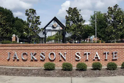 A sign marks the west entrance at Jackson State University in Jackson, Miss., May 31, 2017. Higher education officials in Mississippi voted Thursday, Nov. 16, 2023, to name Marcus L. Thompson as new president of Jackson State University, the state's largest historically Black university. (AP Photo/Rogelio V. Solis, File)