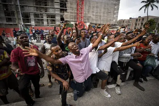 Party agents and supporters of presidential candidate Peter Obi of the Labour Party cheer as their candidate wins the count at a polling station near to the home of ruling party presidential candidate Bola Tinubu, in Lagos, Nigeria Saturday, Feb. 25, 2023. Voters in Africa's most populous nation are heading to the polls Saturday to choose a new president, following the second and final term of incumbent Muhammadu Buhari. (AP Photo/Ben Curtis)