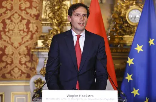 Deputy Prime Minister of the Netherlands Wopke Hoekstra delivers a speech next to France's European and Foreign Affairs Minister Jean-Yves Le Drian during a press conference, in Paris, Friday Jan 28, 2022.  The Netherlands said on Tuesday, March 29, 2022, it was expelling 17 Russians who it described as intelligence officers masquerading as diplomats. Dutch Foreign Minister Wopke Hoekstra said he was prepared for a retaliation from Moscow. (Thomas Coex/Pool photo via AP, File)