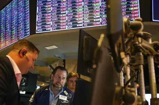 Traders work on the floor at the New York Stock Exchange in New York, May 19, 2022. Stocks are opening lower on Wall Street Tuesday, May 24, 2022 led by drops in tech heavyweights like the parent companies of Facebook and Google. The S&P 500 index fell 1.2% in the early going, and the tech-heavy Nasdaq was down almost twice as much, 2.3%. (AP Photo/Seth Wenig)