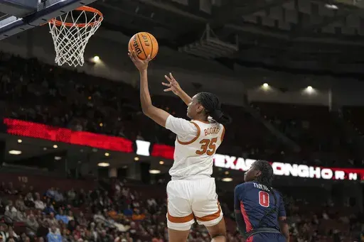 Texas forward Madison Booker (35) shoots over Mississippi guard Sira Thienou (0) during an NCAA college basketball game in the quarterfinals of the Southeastern Conference tournament, Friday, March 7, 2025, in Greenville, S.C. (AP Photo/David Yeazell)
