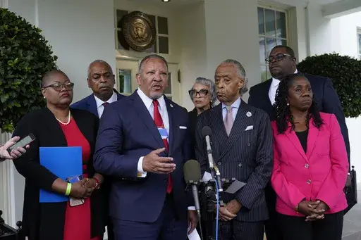 Marc Morial, center, President and Chief Executive Officer of the National Urban League, talks with reporters outside the West Wing of the White House in Washington, July 8, 2021, following a meeting with President Joe Biden and leadership of top civil rights organizations. Extreme views adopted by some local, state and federal political leaders who try to limit what history can be taught and undermine how Black leaders perform their jobs are among the leading threats to democracy for Black Amer