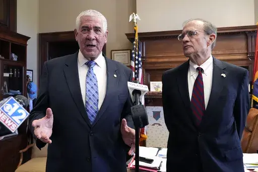Mississippi Republican Lt. Gov. Delbert Hosemann, right, listens as Senate Medicaid Committee Chairman Sen. Kevin Blackwell, R-Southaven, provides details on the body's passing a Medicaid expansion bill at the state Capitol in Jackson, Miss., Thursday, March 28, 2024. (AP Photo/Rogelio V. Solis)